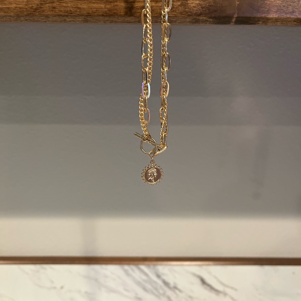 Gold necklace with gold pendant